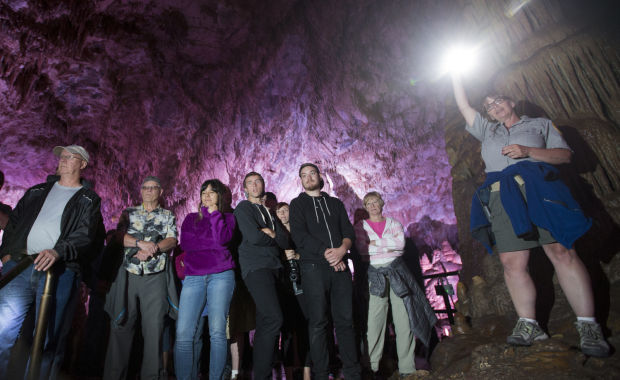 Pam Schroeder guides tourists through the caverns